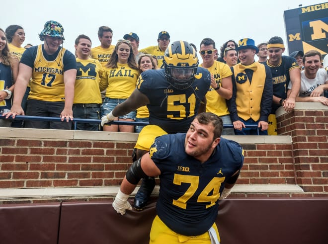 Michigan Wolverines football's Ben Bredeson (front) and Cesar Ruiz