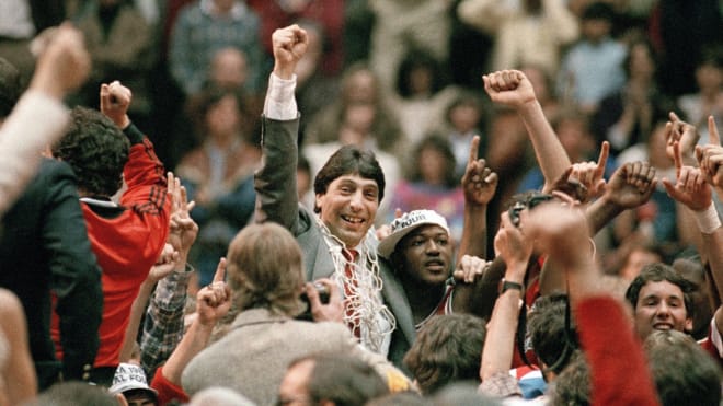 NC State basketball coach Jim Valvano and senior guard Dereck Whittenburg celebrated after winning a national title.