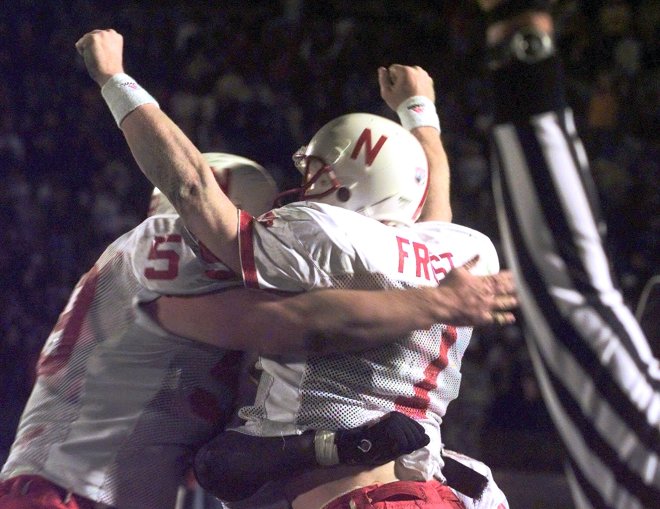 Quarterback Scott Frost celebrates as Nebraska stuns Missouri to tie the game at 38-38 at the end of regulation.