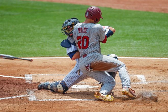 Jonah Bride collides with the URI catcher in the 1st inning of Sunday afternoon's game 