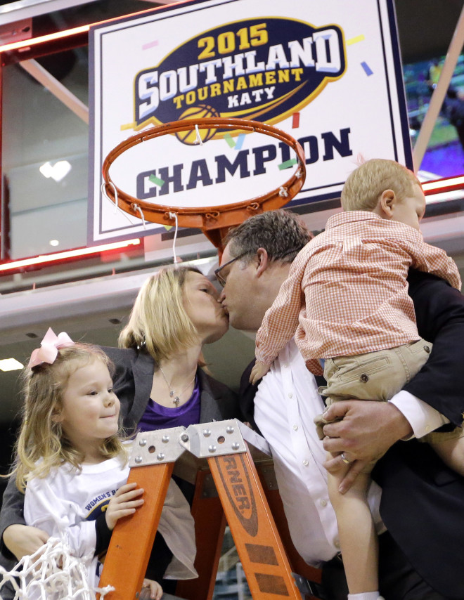 Brooke and Scott Stoehr celebrate the 2015 Southland Conference Championship with their children Aubrey and Cooper.