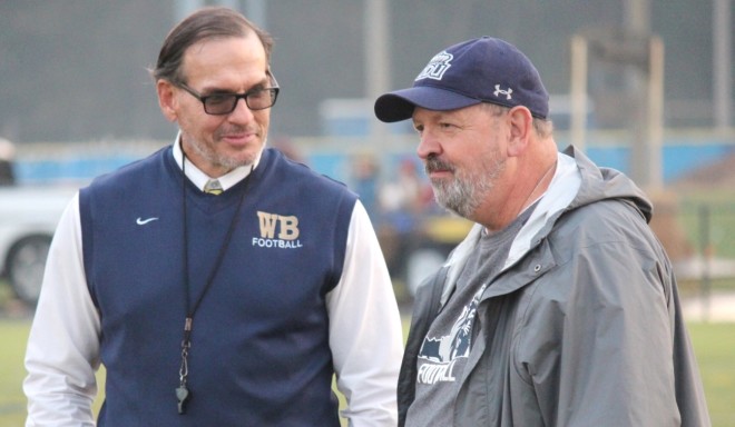 Bill Dee (right), chatting with Western Branch's Greg Gibson (left), will now lead Oscar Smith