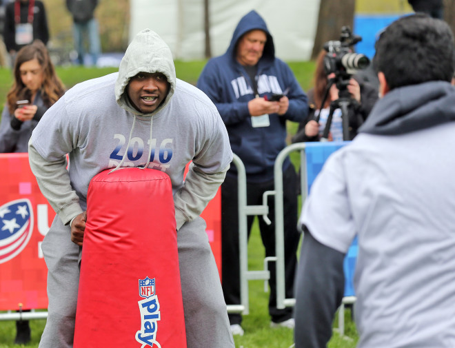 Former Ole Miss offensive tackle Laremy Tunsil works with Chicago-area youth Wednesday morning in Grant Park in Chicago. Tunsil was participating as part of the NFL's Play 60 program.