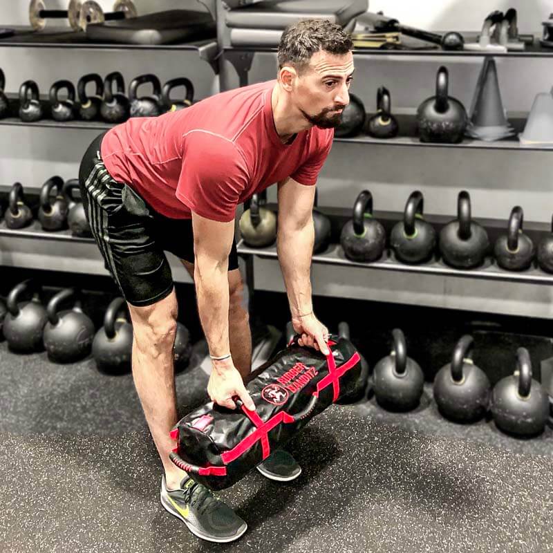 Sandbag Workout to Test Your Coordination and Torch Your Core