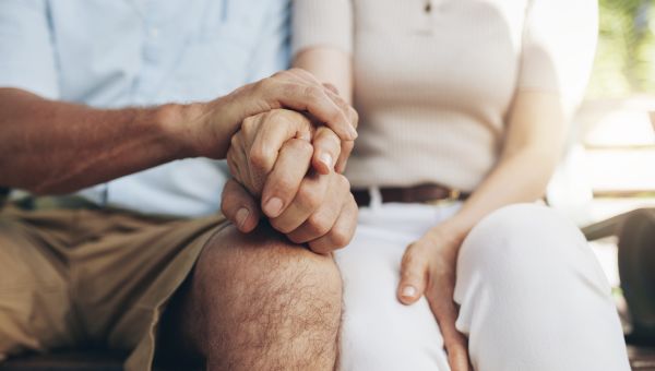 close up of couple holding hands