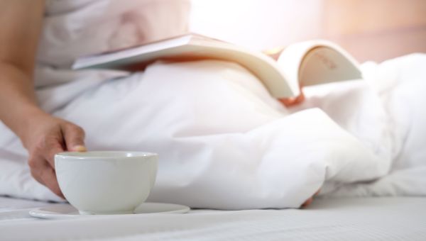 mug, bed, book, white comforter