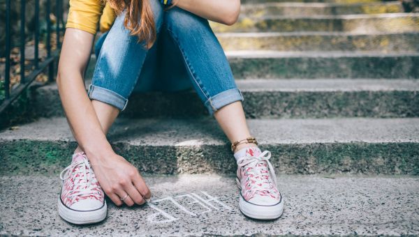 teen girl, writing help on sidewalk, chalk, pink converse