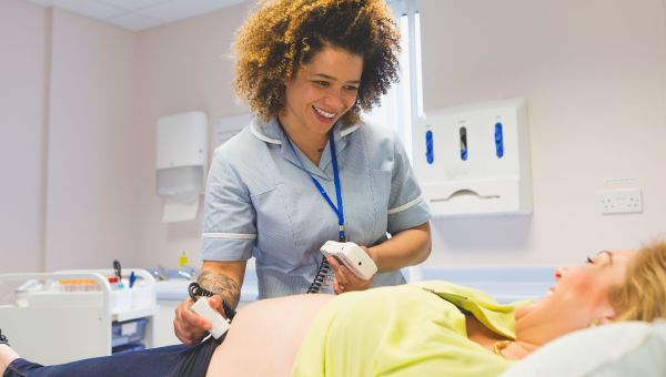 nurse, pregnant woman, doctor's office, ultrasound