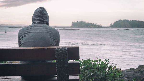 lonely man sitting on a bench