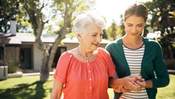 woman helping elderly