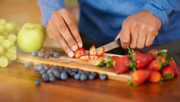 woman cutting fruit