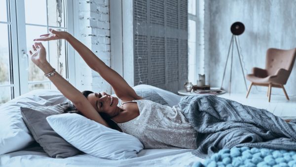 Woman stretching after waking up