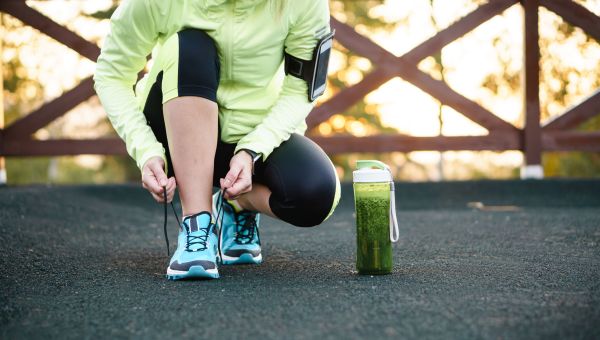 Woman tying her running sneakers