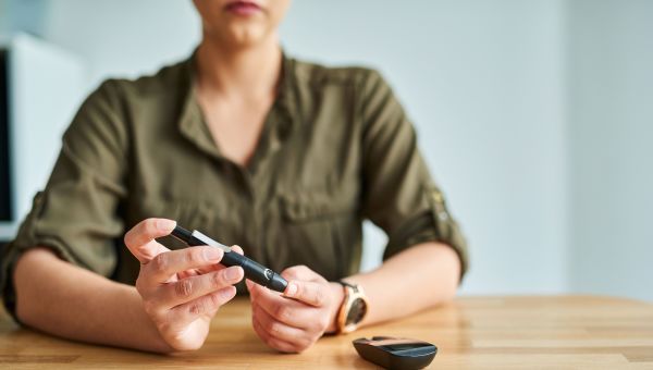 Woman checking her glucose levels