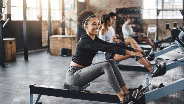 the woman exercising on the rowing machine