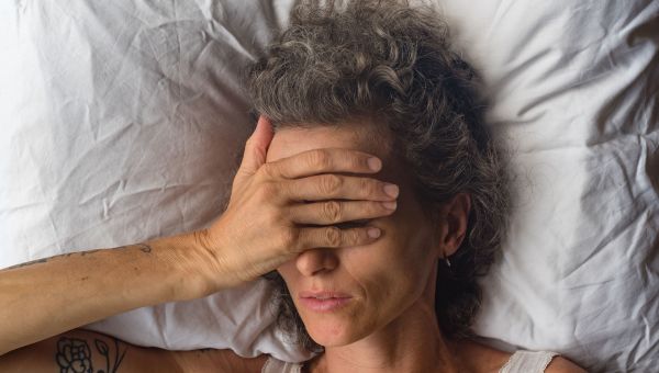 Middle-aged woman having difficulty sleeping