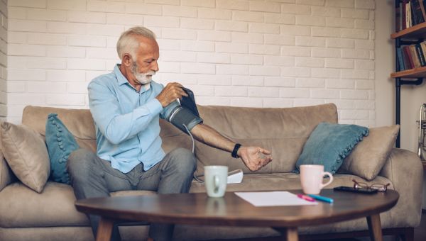 older man measuring blood pressure