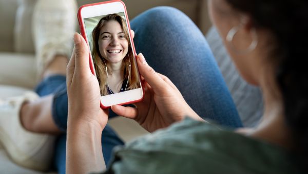 woman talking with friend on her phone