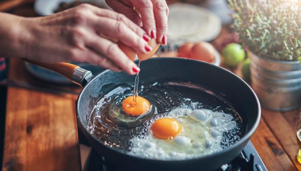 frying eggs in the kitchen