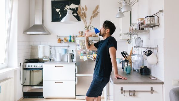 man drinking a smoothie