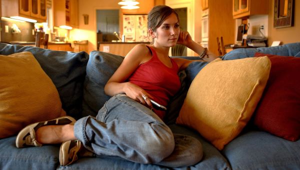 young woman sitting on a couch
