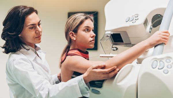young person getting a mammogram