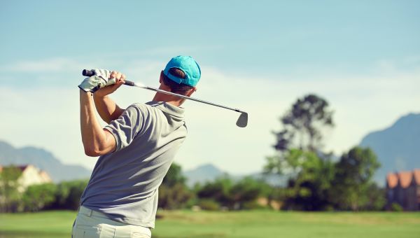 young man golfing