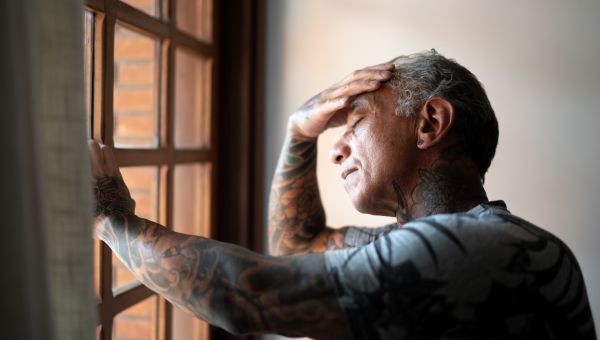 Man looking out the window