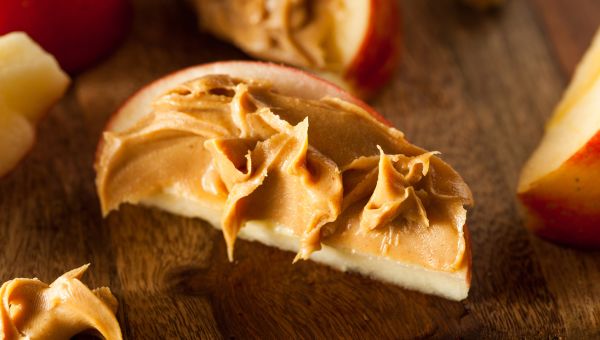 Peanut butter spread of apple slice.