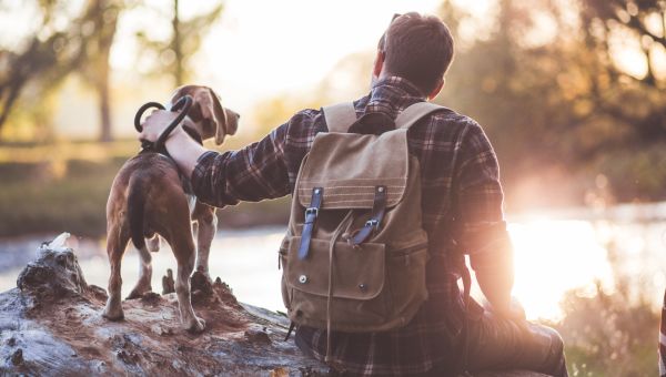 man with dog outdoors