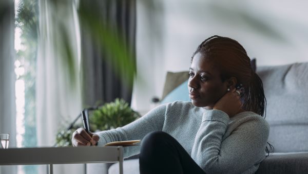 woman writing down feelings