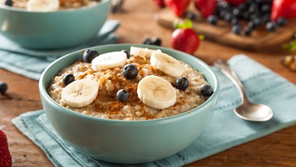 Oatmeal and fruit n a light blue bowl
