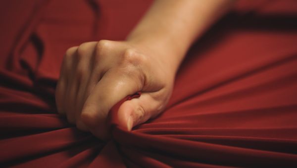 sex hand red sheets
