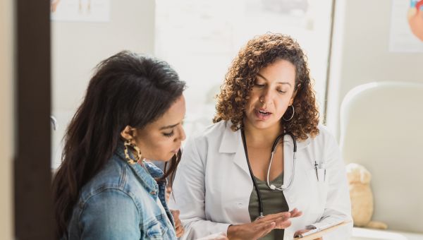 female doctor discussing exam results with a female patient