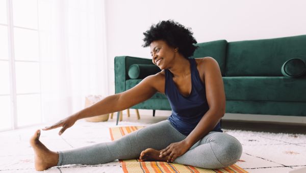 woman stretching on mat