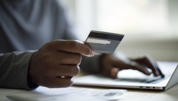 man setting up autopay on a bill