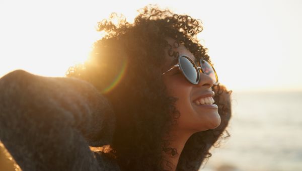 woman with big sunglasses outdoors, sun care