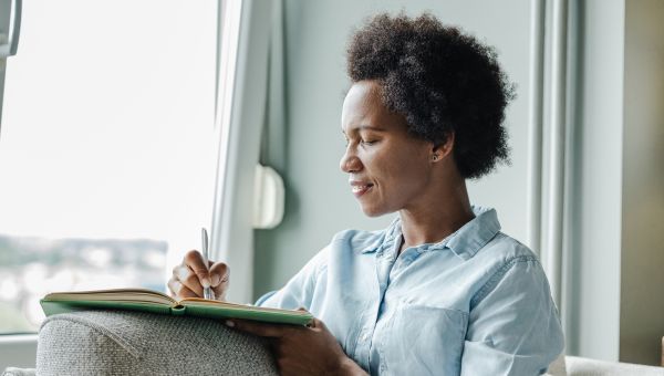 woman writing in journal