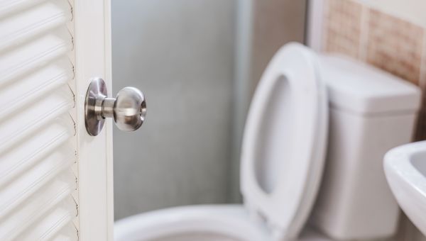 door opening to home bathroom toilet