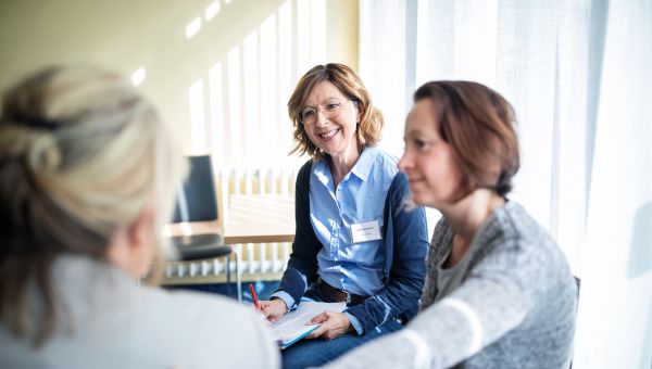 obgyn talking with woman and friend