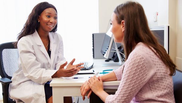 A gynecologist answering her patient's questions
