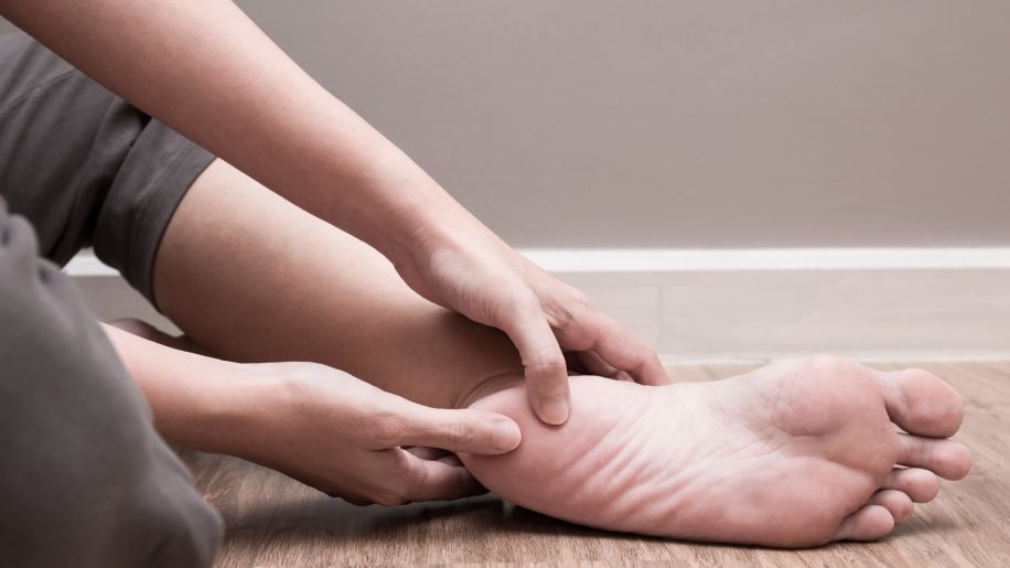 Woman massaging foot pain