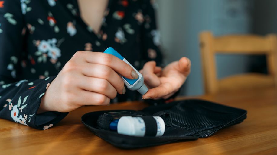Woman checking her blood sugar