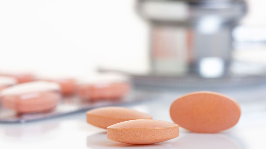 Orange pills on counter