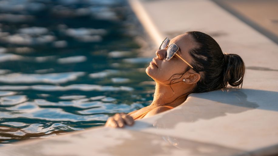 woman lying back in a pool