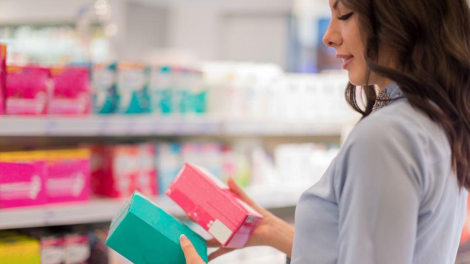 Woman shopping for tampons