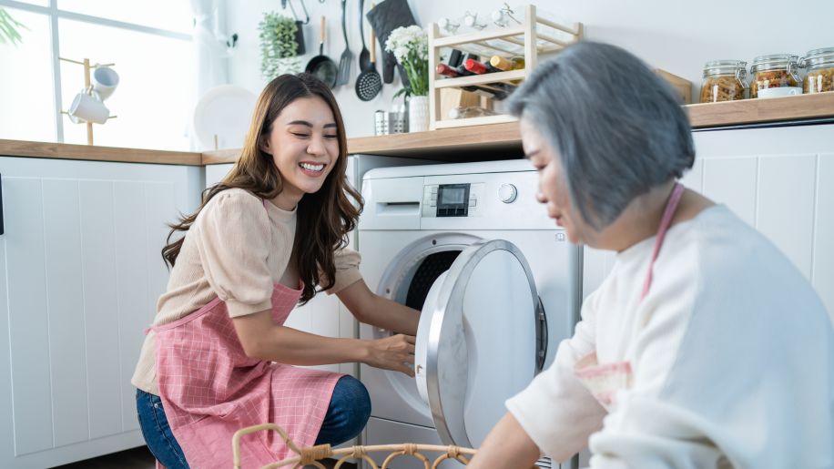 woman helping mother with luandry