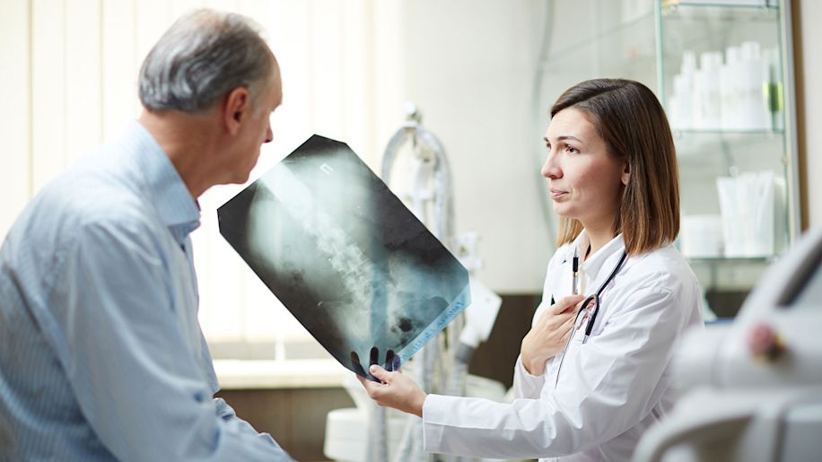 Doctor showing an x-ray to a patient