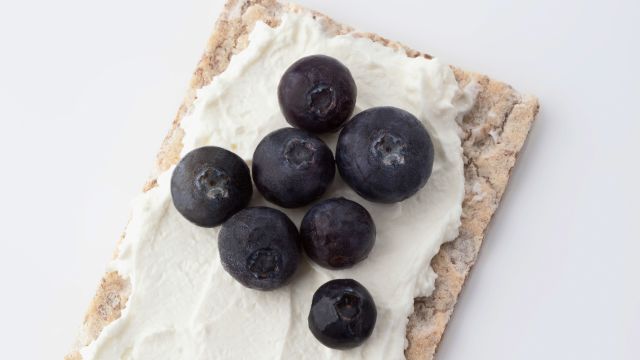 cracker with cream cheese berries