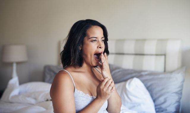 A man covers his bad morning breath. How can he get rid of morning breath?  